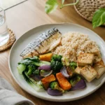 A balanced plate with brown rice fish tofu and colourful vegetables